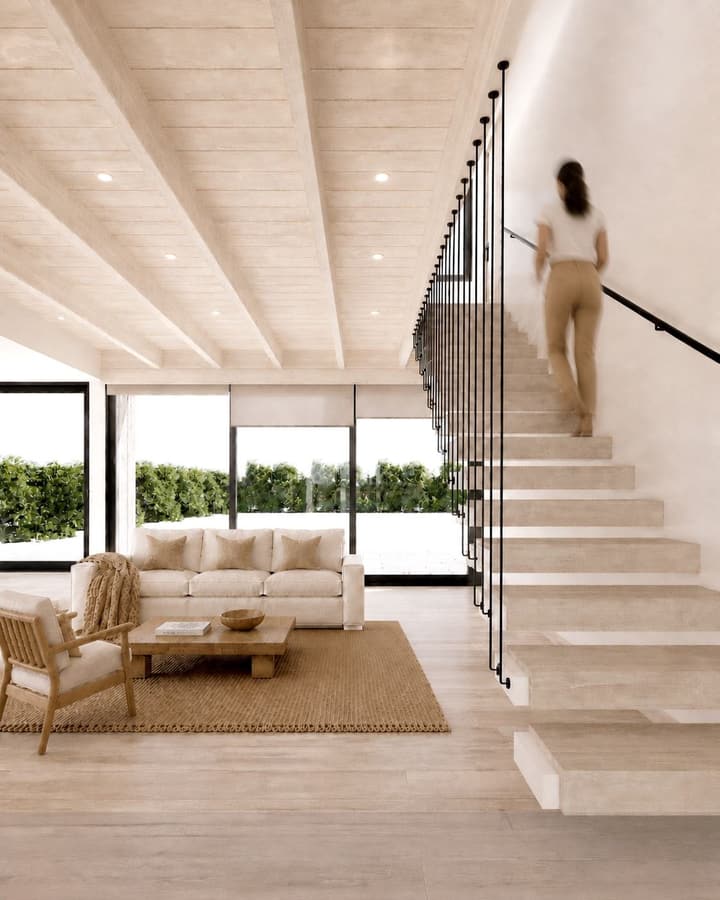 Escalera y living con vista al jardín