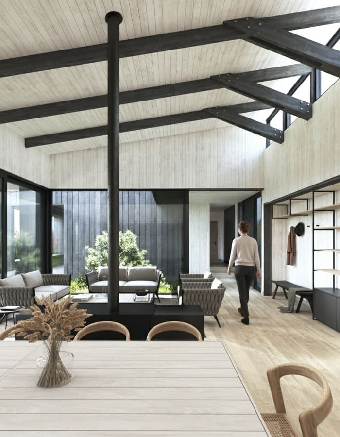 Living con patio interior y circulación hacia los dormitorios
